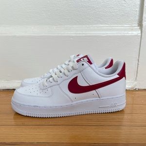 Nike Air Force ones with red swoosh